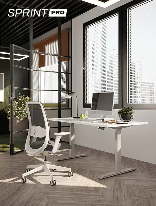 height-adjustable base with chair and computer in an office