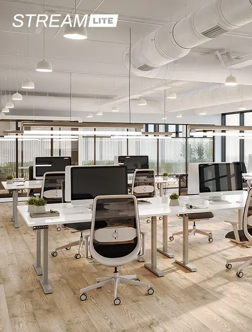 open office with several desks, chairs, and privacy pods