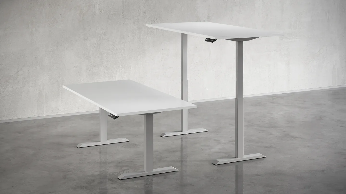 two silver height-adjustable bases next two each other showing the minimum and maximum height